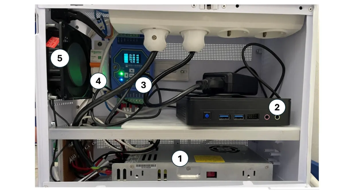 Open Perta-SMART enclosure with edge computer and acquisition hardware.